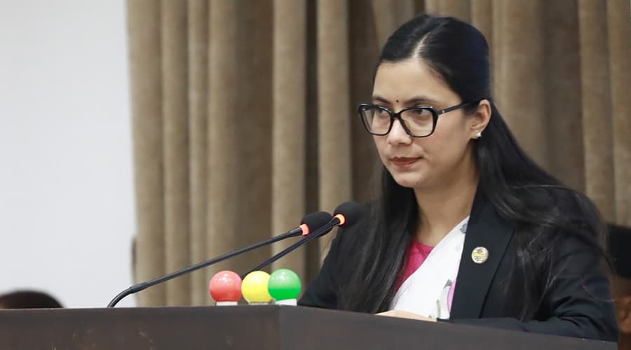 Minister Sobita Gautam speaks at the rostrum in the House of Representatives.