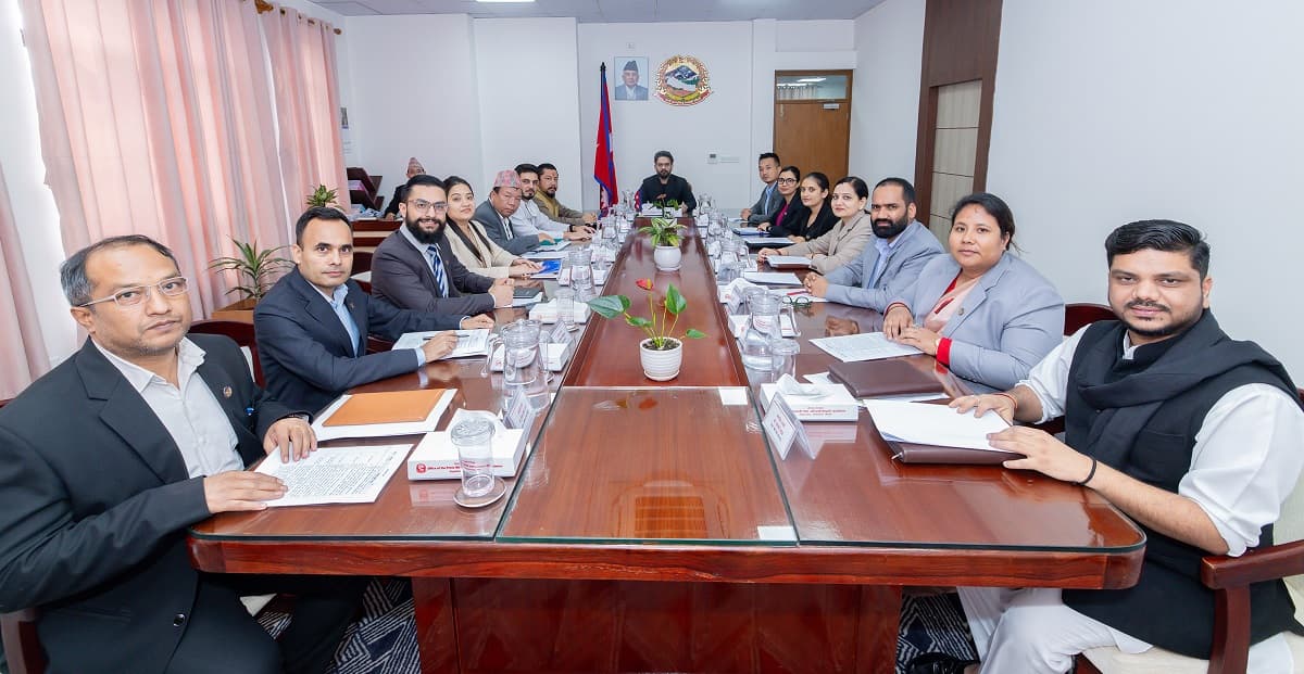 Prime Minister Balen Shah chairs a meeting of the Council of Ministers around a wooden boardroom table.