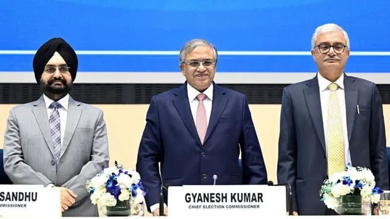 Indian Chief Election Commissioner Gyanesh Kumar flanked by dissenting Election Commissioners Sukhbir Singh Sandhu and Vivek Joshi.