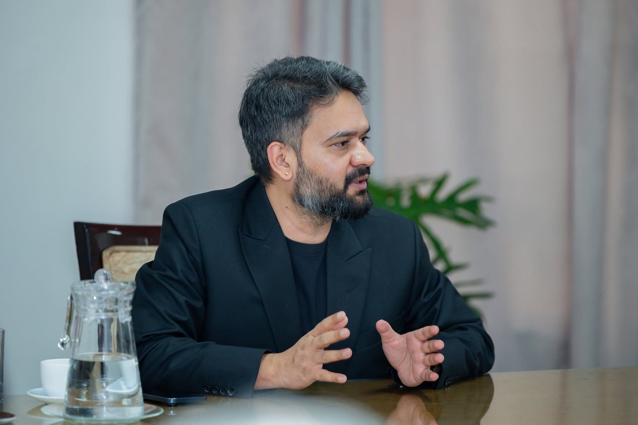 Minister for Physical Infrastructure and Transport Sunil Lamsal gestures while speaking during a consultation on construction sector reforms.