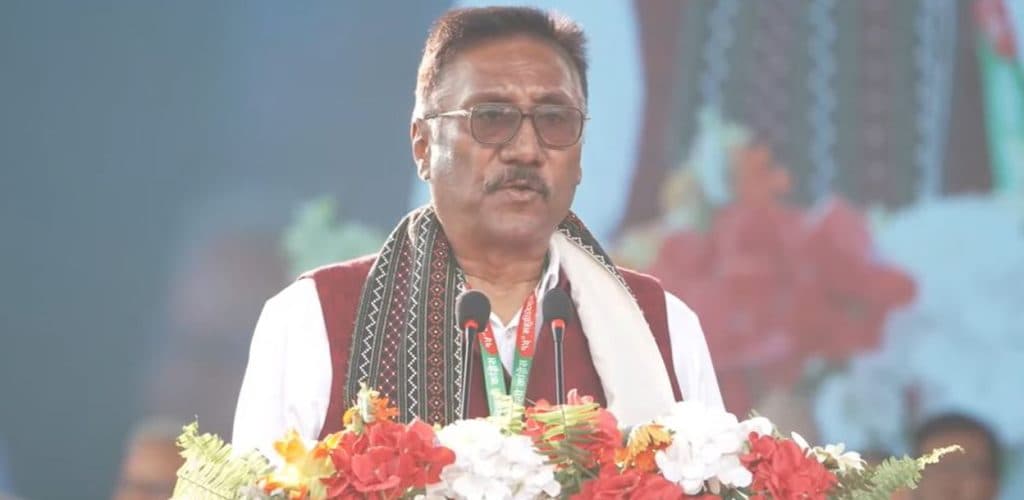 JSP Nepal leader Sharat Singh Bhandari speaks into microphones at the Nepali Congress convention.
