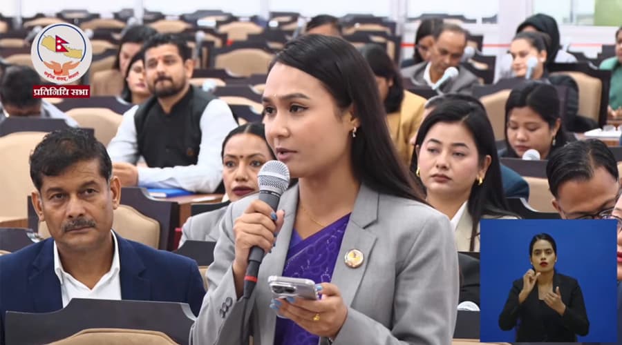 Rastriya Swatantra Party lawmaker Nisha Dangi speaks into a microphone in the House of Representatives.