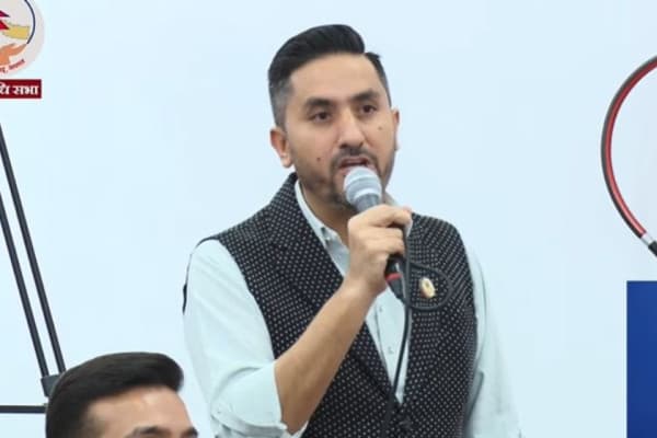 RSP lawmaker Jagadish Kharel speaks into a microphone during a House of Representatives meeting.