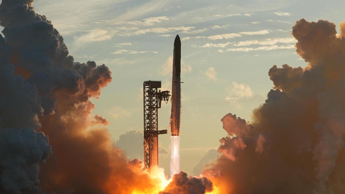 SpaceX Starship rocket lifting off into the sky propelled by bright flames and heavy exhaust smoke.