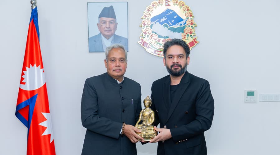 Prime Minister Balen Shah and Indian Ambassador Naveen Srivastava holding a statue of Buddha during a farewell meeting in Kathmandu.