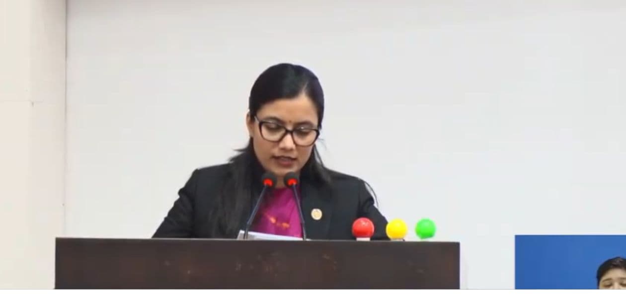 Law Minister Sobita Gautam addresses the House of Representatives from the rostrum.