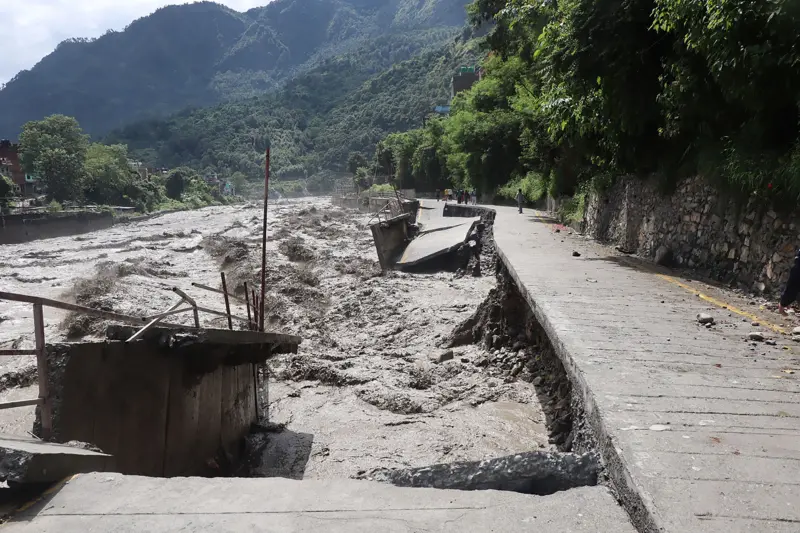 A cracked and collapsed road section eroded by floodwaters along the Kali Gandaki Corridor.