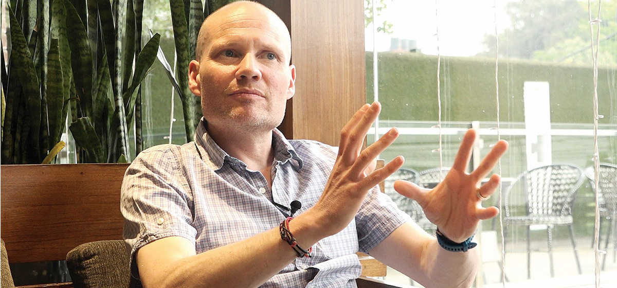Glaciologist Professor Duncan Quincey gesturing during an interview.