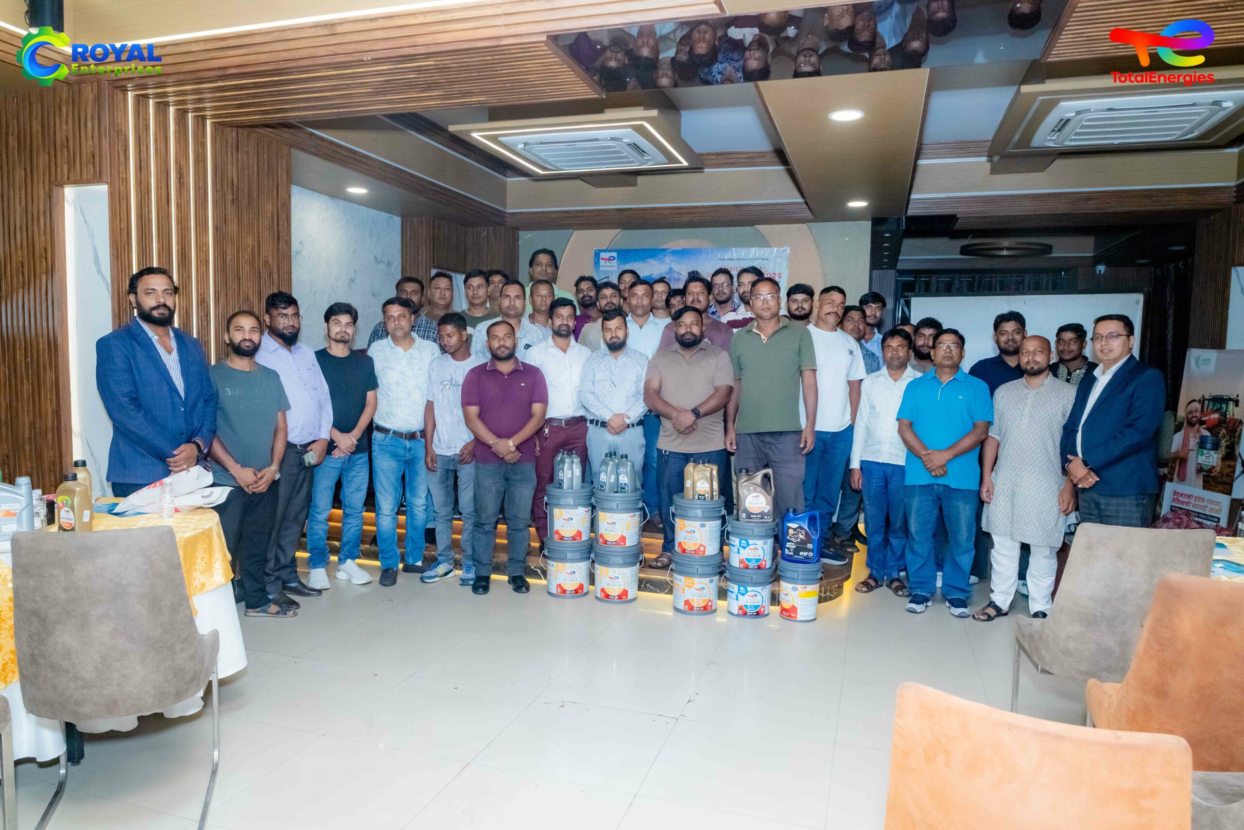 Participating garage mechanics and organizers pose together during a Laxmi Lube Oil technical meet.